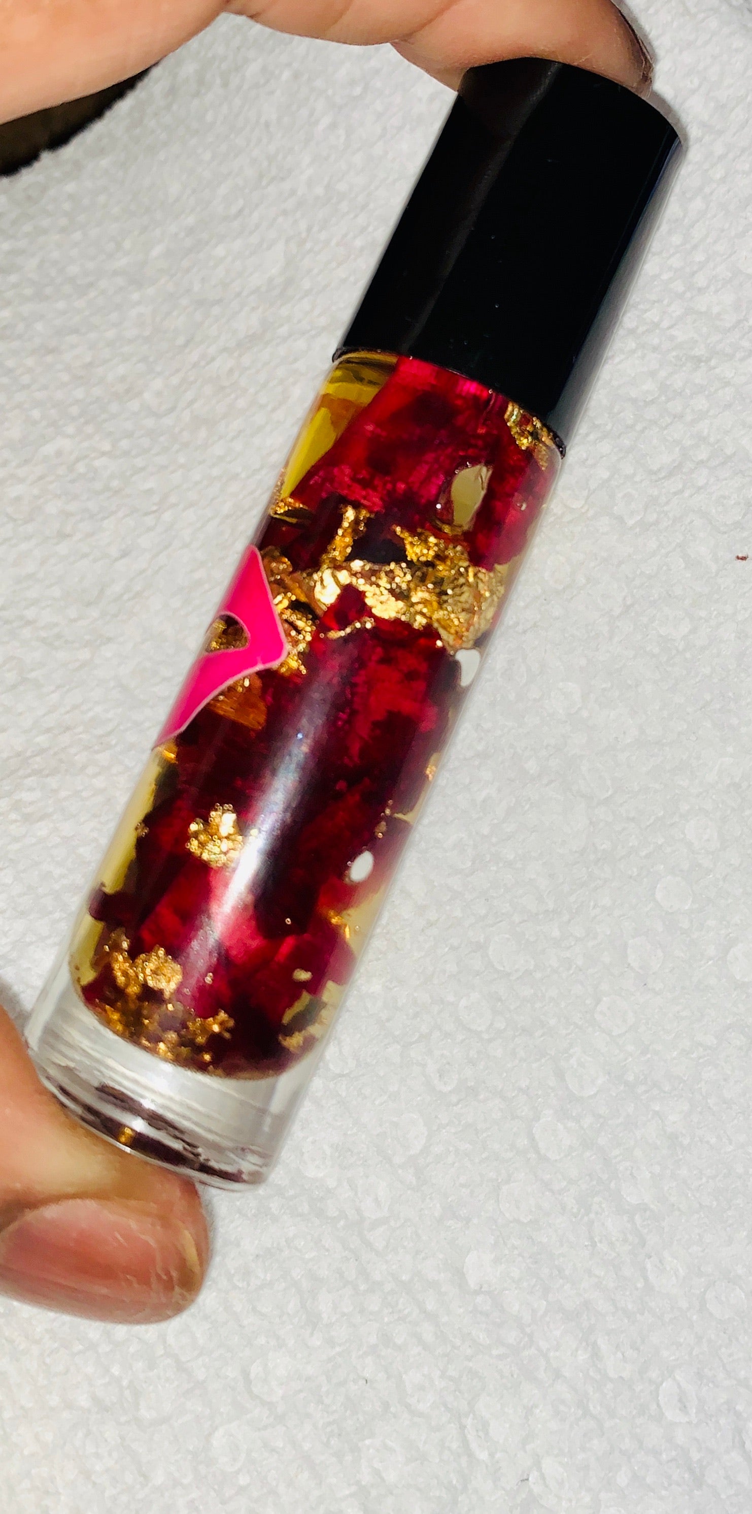 Rose Oil Lip Serum infused with gold flakes